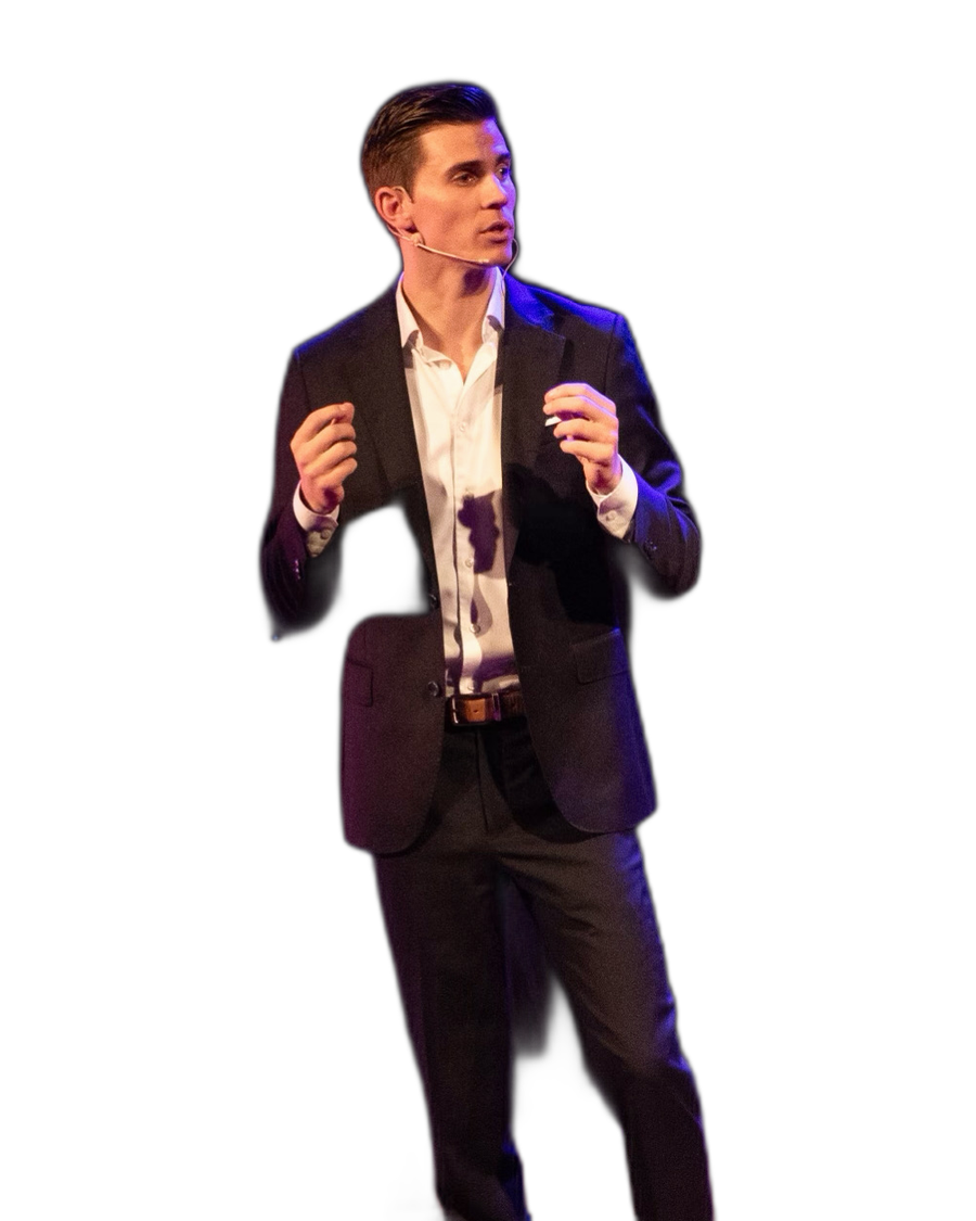 Grant Mitterlehner speaking on stage